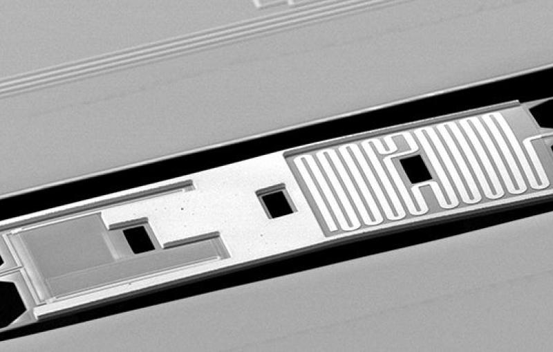 Image - The BICEP2 detector shown in this electron-beam micrograph works by converting the light from the cosmic microwave background into heat. A titanium film tuned on its transition to a superconducting state makes a sensitive thermometer.