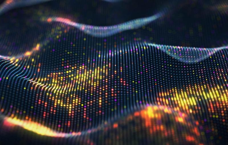 an abstract illustration of rippling waves made of shining dots