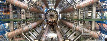 Eight pipes arrayed in a circle lead to a central experimental apparatus.