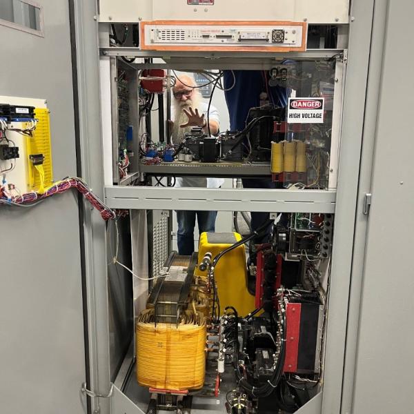 This photograph shows 2023 Lytle award winner Jim Sebek at work on SSRL's electrical systems.